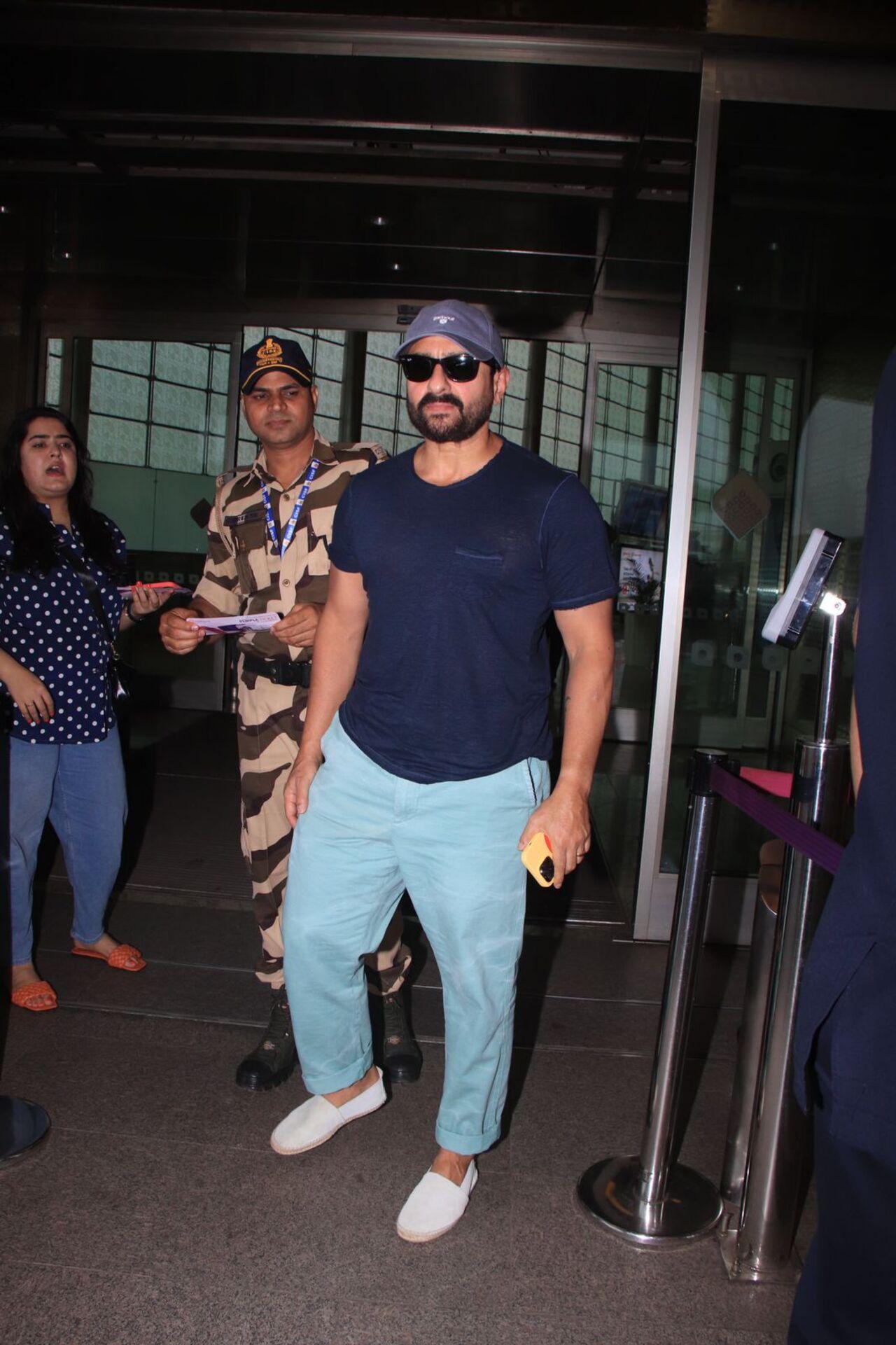 Saif Ali Khan was spotted at the airport today. He wore a blue T-shirt and pants